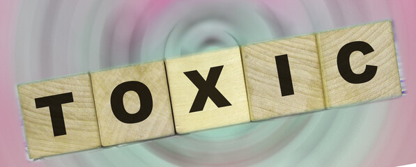 Toxic Word written on wooden cubes. Detox intoxication rehab stop smoking and drinking concept