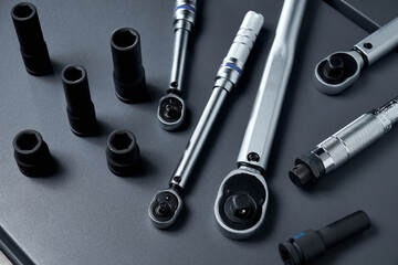 Torque wrenches set or spanners car repair. Tools for professional or self-repair car. Dark gray...