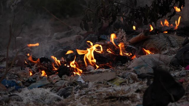 Close up view of burning plastic waste causing air pollution