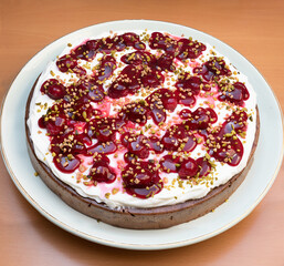 healthy cake with cherry marmelade, pistachios and vegan whipped cream