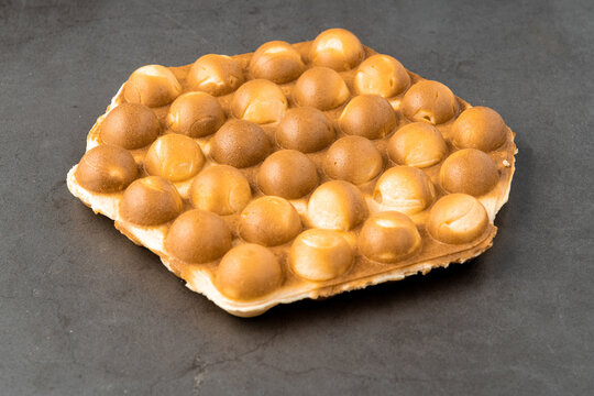 bubble waffle without topping on stone background