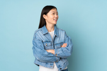 Young asian woman isolated on background happy and smiling