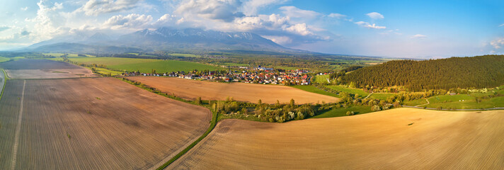 Agriculture industry. Arable fields. Aerial view of Tatra range. Slovakia farmland valley