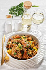 braised Rabbit with potatoes in a white bowl