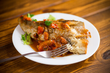 whole fish hake stewed with carrots, beets, peppers and other