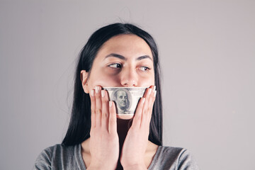 women with a dollar bill in their mouths