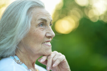 Fototapeta premium beautiful smiling senior woman in spring park