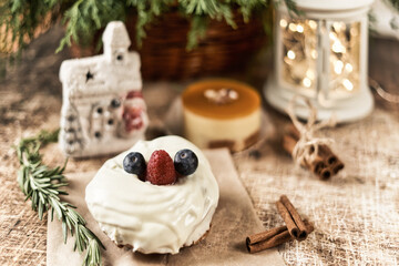 Cake decorated with blackberries and raspberries on the New Year table