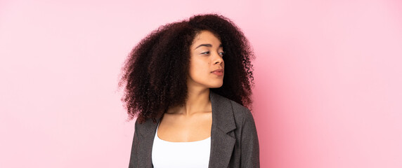 Young african american woman over isolated background looking to the side