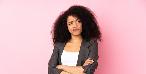 Young african american woman over isolated background with unhappy expression