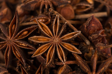 Anise star seeds, aromatic Asian spices ingredient in cooking, star anise background.