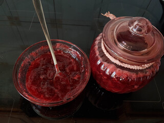 strawberries fresh  jam on the table spoon bowl food background