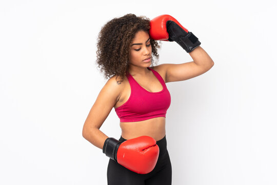 Young African American sport woman isolated on white background with boxing gloves