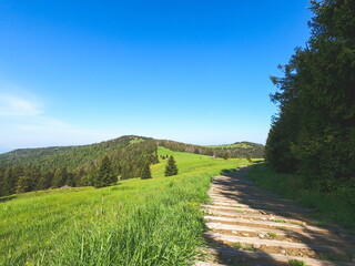 View of Beskidy mountains in Poland taken in sunny spring. Mountain landscape captured during trekking.