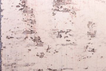 The wall of the house is with shabby, peeling plaster. ..
