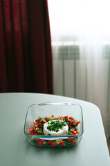 Vegetables with cheese. Vegetables with camembert cheese. Salad with soft cheese.