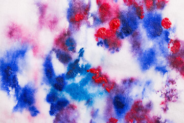 watercolour brush strokes with paint on paper. blue and purple