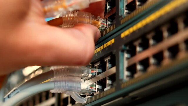 Network Equipment In Server Room.Ethernet Patch Cord And Lan Switch Router In Data Center.Cloud Server Hardware. Ethernet Cable And Blinking Light On Web Switch Rack Cabinet.Network Infrastructure.