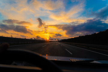 Fototapeta na wymiar Sunset from old car