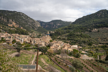 Fototapeta na wymiar Beautiful sunny landscape of the village of Valldemossa in the Tramuntana mountain range. Palma de Mallorca, Spain