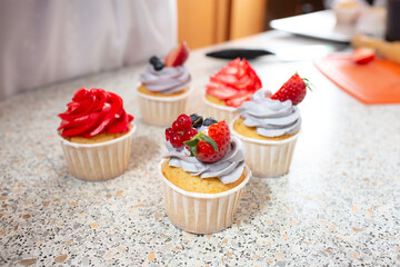 cupcake with cream currant strawberry and blackberry