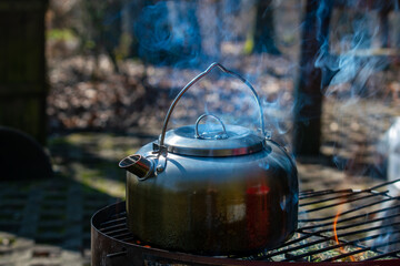 kettle on the fire, kettle on the table, kettle on the stove, teapot on a wooden table