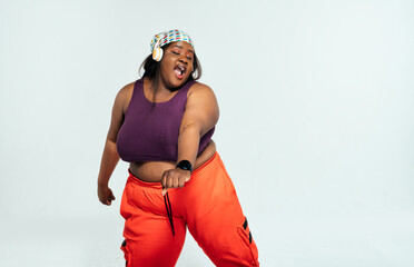 Young woman dancing and making functional training at the gym