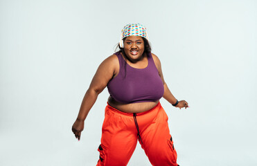 Young woman dancing and making functional training at the gym