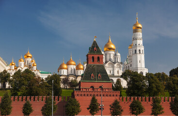 Fototapeta na wymiar View of the Moscow Kremlin with the Grand Kremlin Palace, cathedrals and the bell tower of Ivan the Great on a sunny summer day. Russia