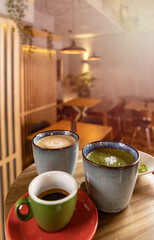 Cups of coffee, espresso and matcha latte