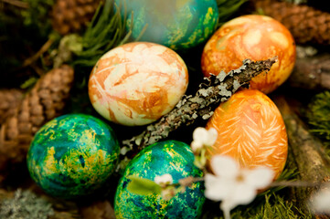 Easter. a Christian religious holiday. speckle chicken eggs in basket. tradition to variegate with various colors and various techniques. biggest spring celebration.