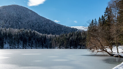 Frozen lake of fusine in a sunny afternoon, Friuli-Venezia Giulia, Italy