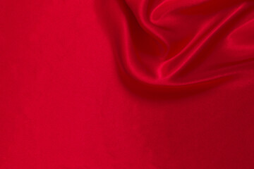 Red silk or satin luxury fabric texture can use as abstract background