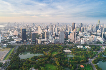 Fototapeta na wymiar Aerial view of green trees in Lumpini Park downtown Financial district center in Sathorn district sBangkok