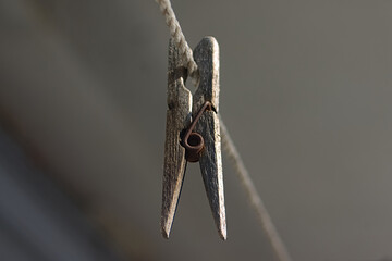 old wooden clothespin on a rope