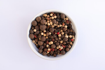 top view five pepper seeds on bowl isolated