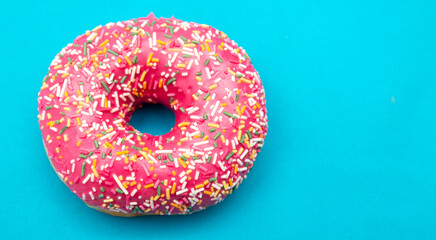 Red donut on a blue background.