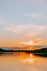 Fototapeta na wymiar Sunset over the Lielupe river in Latvia during warm summer evening
