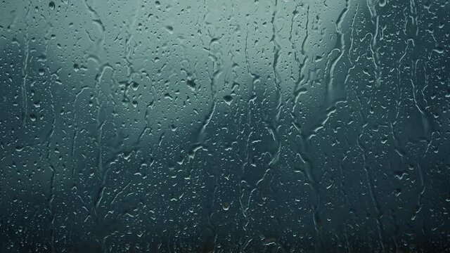 rain days, heavy rain falling on window surface
