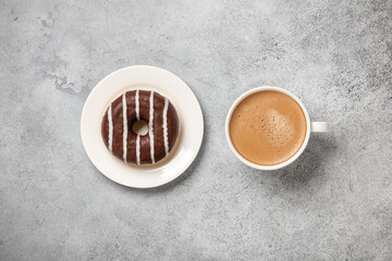 Cup of coffee and chocolate donut