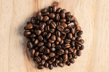 Pile of coffee beans on wood
