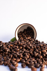 coffee beans in an overturned cup