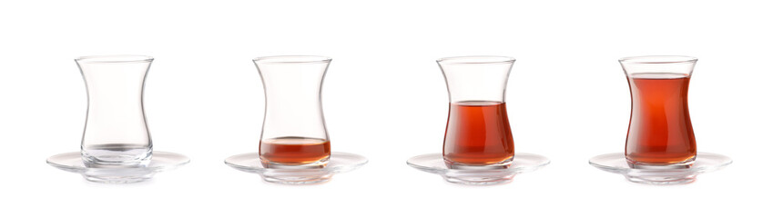 Glass cups with different amount of Turkish tea on white background