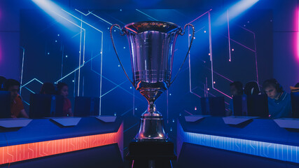 Two Esport Teams of Pro Gamers Play to Compete in Video Game on a Championship. Stylish Neon Cyber...