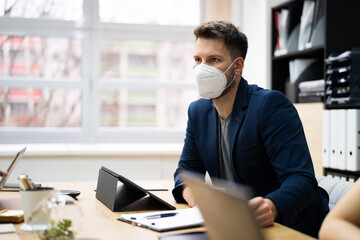 Man Employee In Office Wearing Face Mask Working
