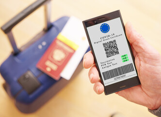 mobile phone with digital green certificate of vaccination covid-19. Phone screen with information about the presence of vaccinations 