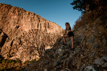 Fototapeta premium beautiful view of woman standing on rocky trail among mountains in Turkey