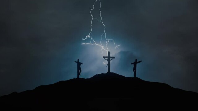 Silhouettes of three crosses on top of a hill in the stormy night. Concept of the Crucifixion of Christ.