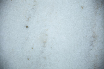 White Marble surface with small brown, green and other colored occlusions and imperfections, background