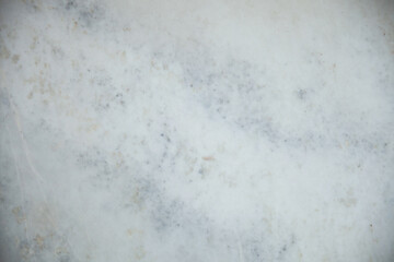 White Marble surface with brown, green and other colored occlusions, background